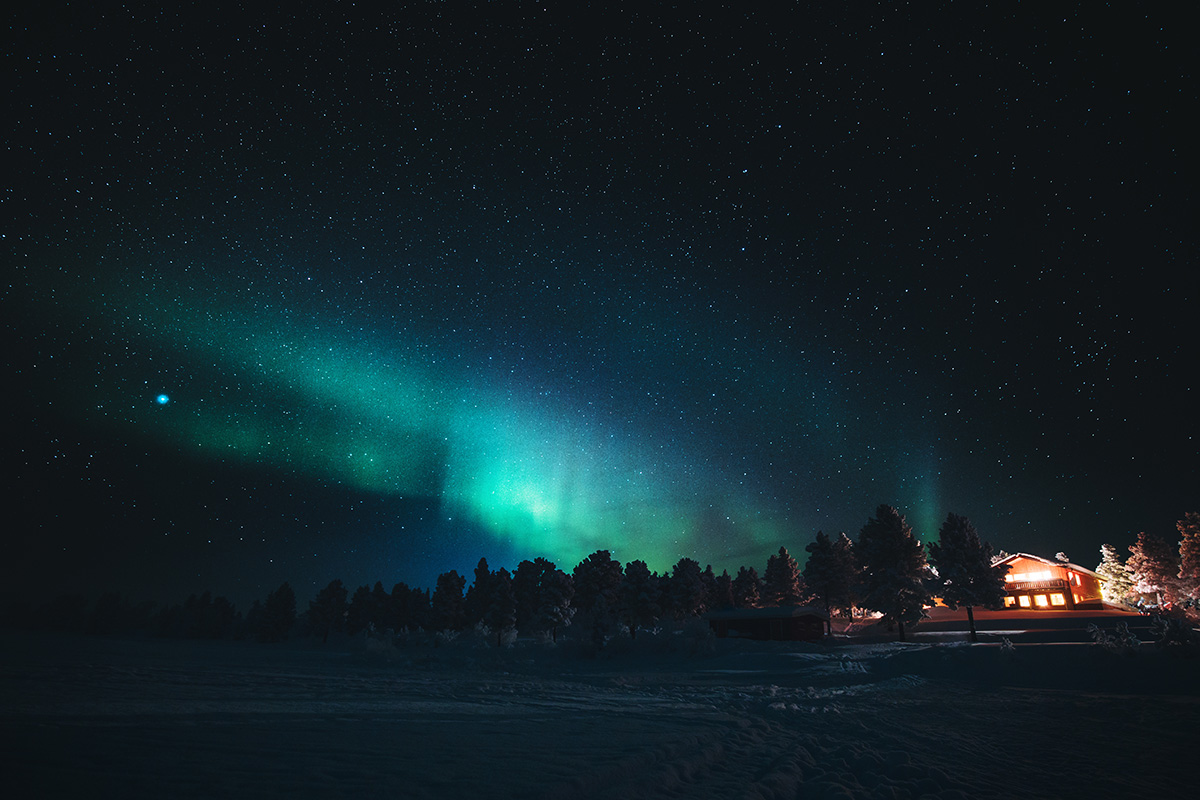 Northern lights aurora chalet Lapland Raphaelle Monvoisin
